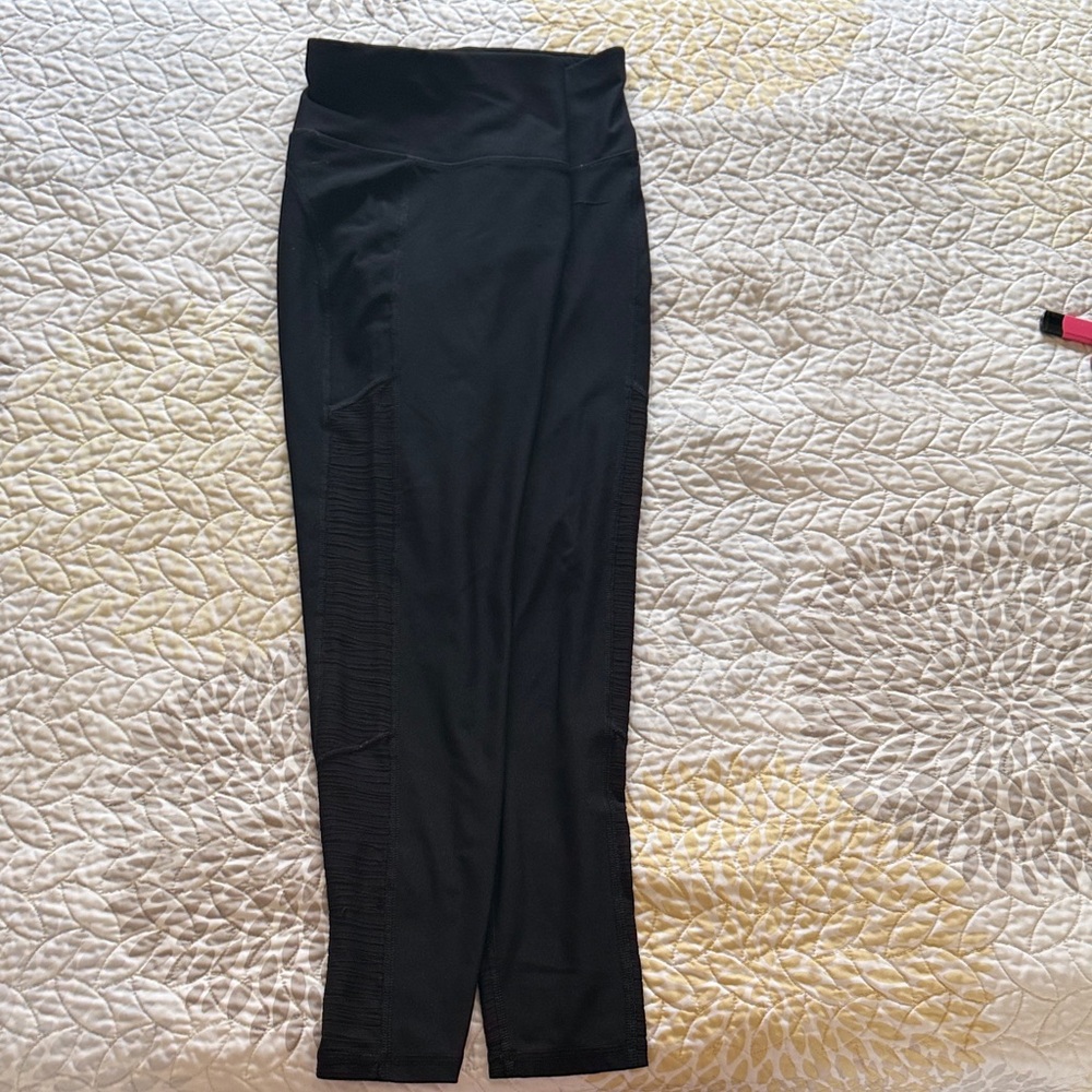 Moret Ultra Black High-Waisted Leggings with see through design worn with TLC.